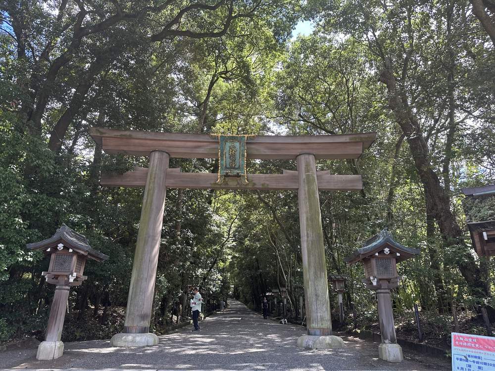 The wooden Ninoтorii gate of Omiwa Shrine surrounded by ancient cedars