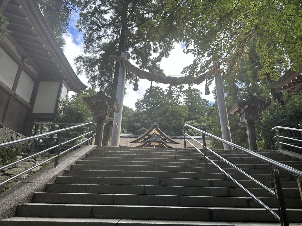 Stone steps and shimenawa leading to the worship hall of Omiwa Shrine