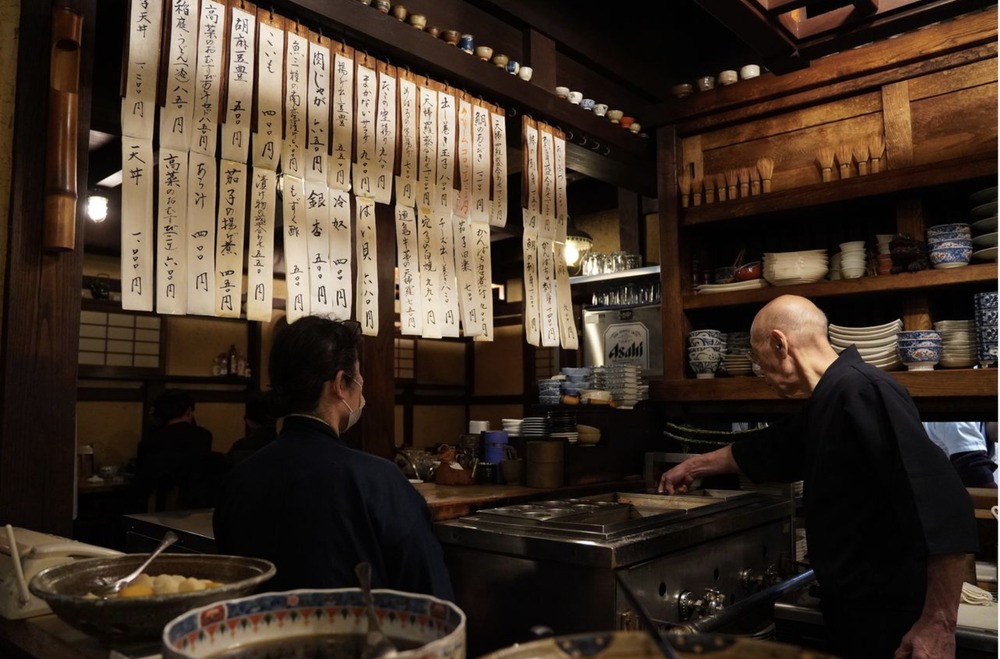 Interior of Shinsui izakaya with hand-written menus