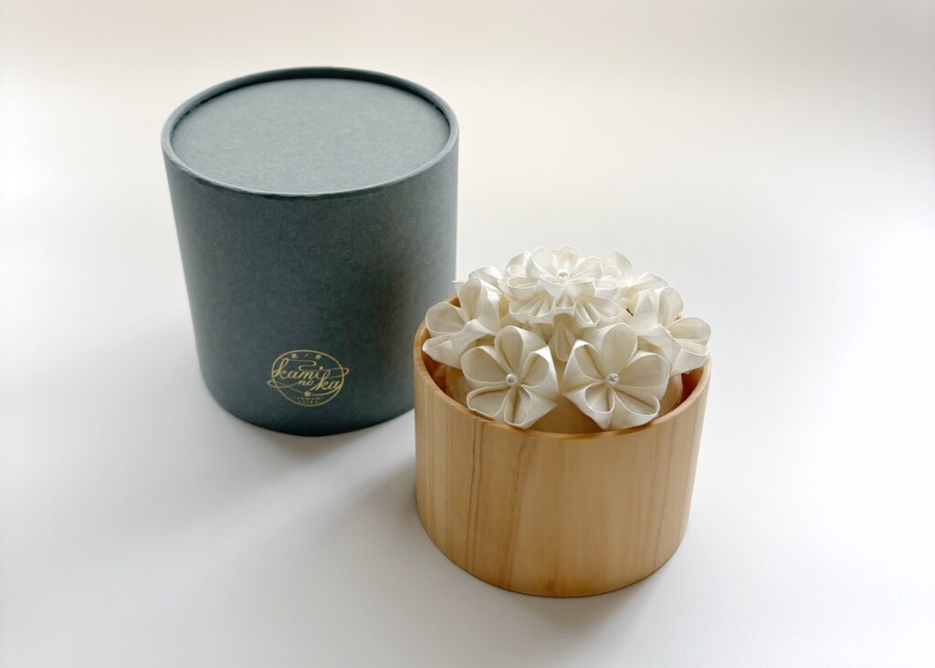 Kaminoka aroma diffuser with white tsumami zaiku silk flowers in a wooden vessel