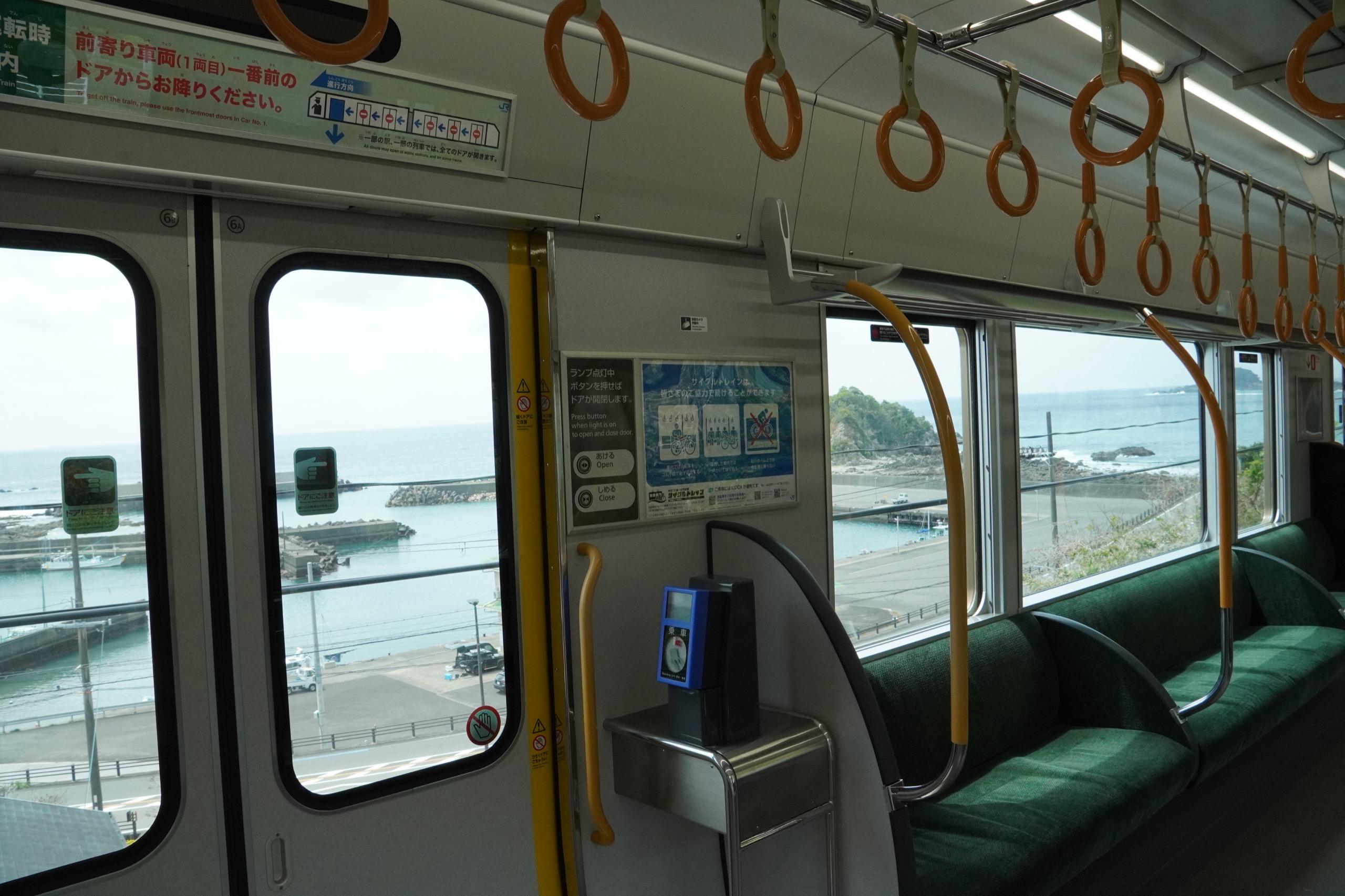 View of the Pacific coast from inside a local JR Kisei Line train on the way to the Kumano region