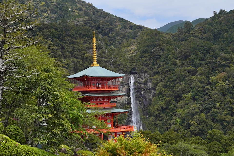 The three-storied pagoda of Seiganto-ji framed against Nachi Falls, the classic view of Kumano