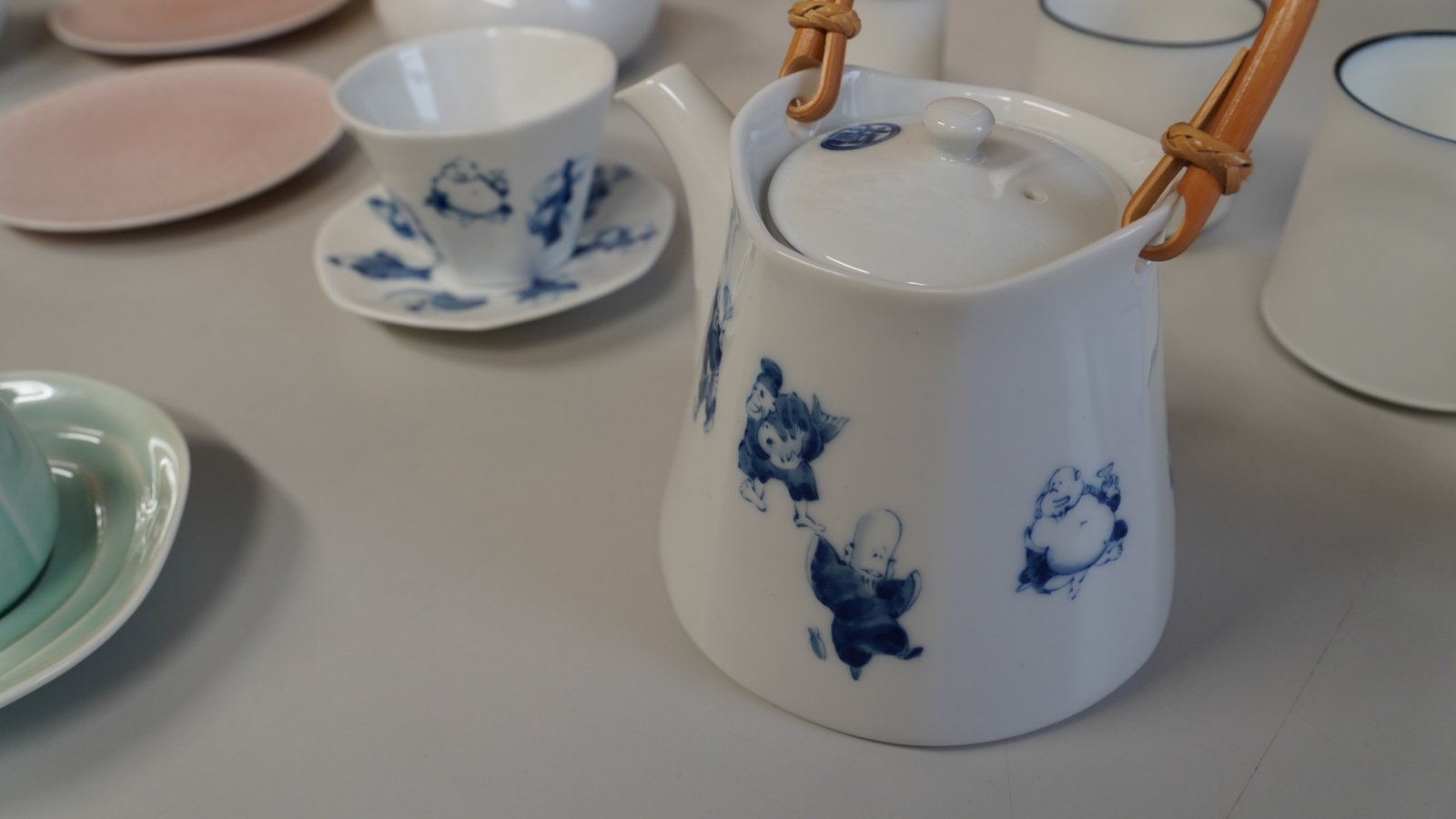 Miyama Shichifuku blue-and-white porcelain teapot with a rattan handle and teacups